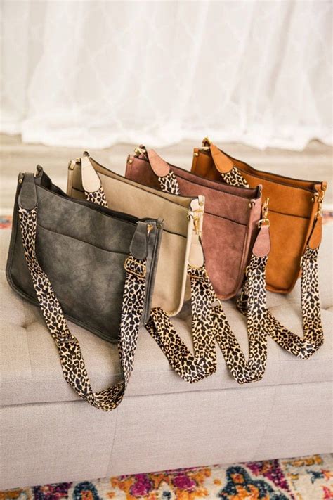 crossbody bag with leopard strap.